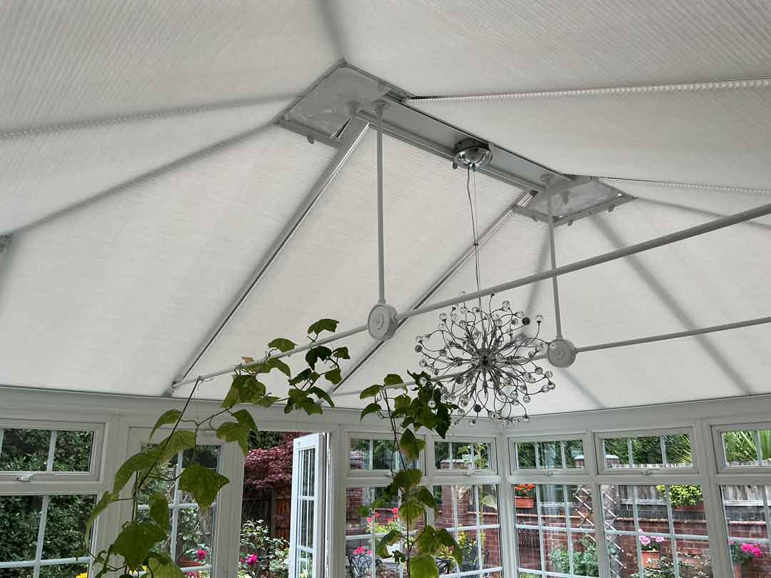 Sleek Automated Roof Blinds in Modern Conservatory